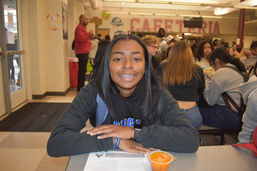 Senior+Taliyah+Holloway+sits+at+the+lunch+table+as+she+awaits+questions+about+her+extracurricular+activities.