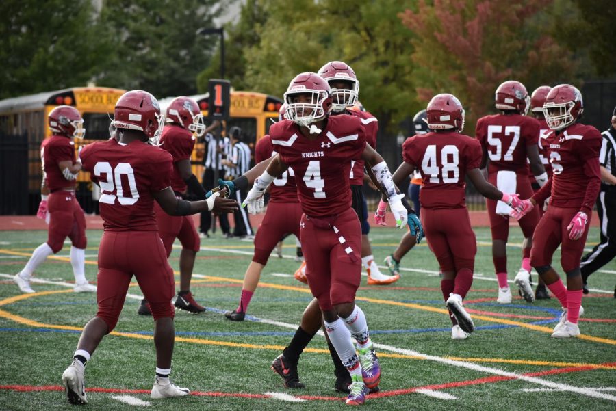 Junior Nathaniel Wiggins celebrates with teammates after scoring a touchdown in the 40-0 win over North Springs in the Homecoming game on Oct. 18. 