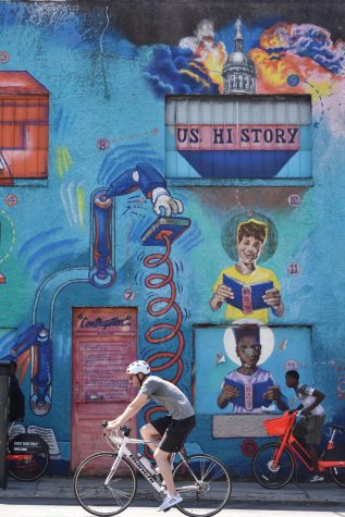 Paragraphalizer, a mural painted by artist Fabian Williams, is a part of the Contraception collection is on Edgewood Avenue. He painted an image to resemble how African American history is often lost in textbooks and education.