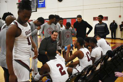 First-year head coach and athletic director Patrick Johnson talks to his team during a timeout in the first half of the boys basketball game against Lithia Springs on Dec. 3. The Knights won 66-61, and are 10-12 overall as of Jan. 30.