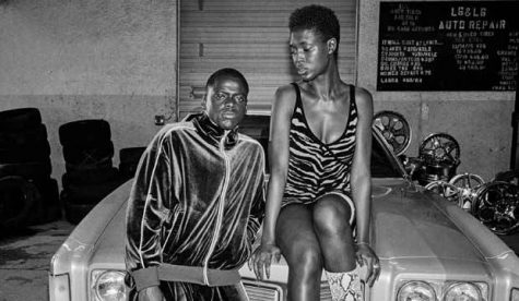 Actors Daniel Kaluuya (left) and Jodie Turner-Smith (right) as “Queen & Slim,” in a film about a couple on the
run after killing a police office in an act of self defense. During a nationwide hunt for the pair, Queen and Slim’s
car breaks down, which results in the identification of their location after this photo is taken at a body shop.