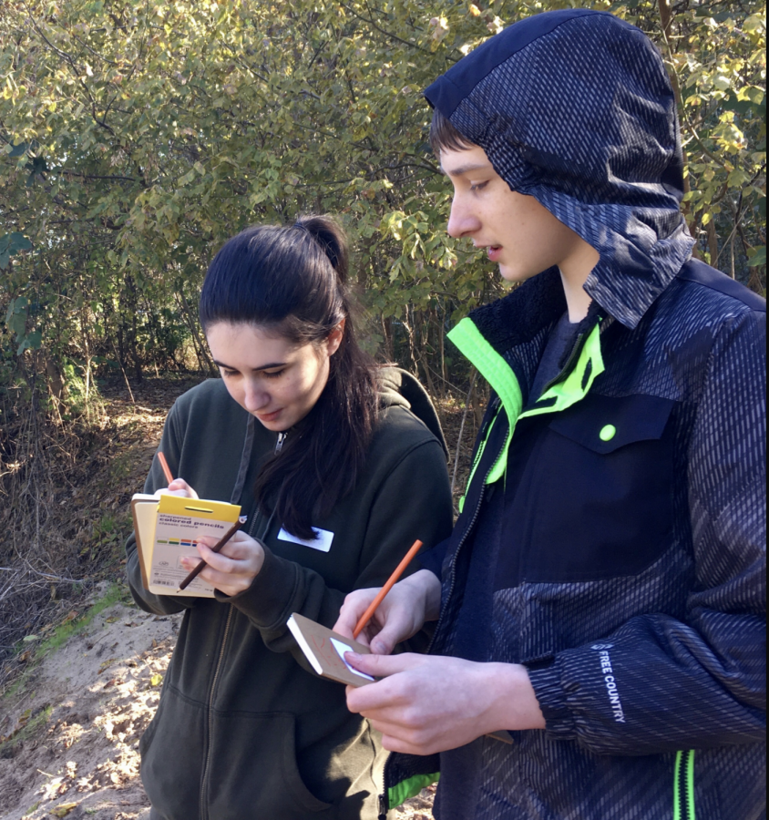 Maura OSullivan, co-founder of Branch Out Initiative, teaches her younger brother, Finn OSullivan, about wildlife. Branch Out specializes in leading inclusive nature hikes.