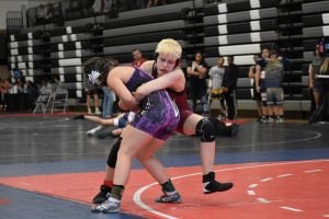 Junior Sophia Little wrestles against an opponent at North Atlanta Warrior Classic tournament during the 2019-20 season. Little is Gradys first female wrestler and is the only one of the Knights to qualify for the state meet. 