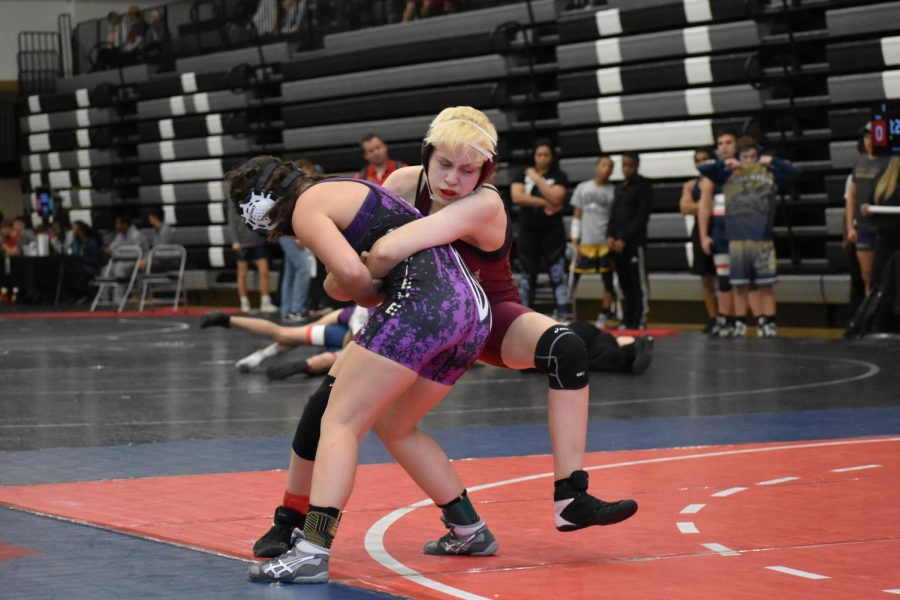 Junior Sophia Little wrestles against an opponent at North Atlanta Warrior Classic tournament during the 2019-20 season. Little is Grady's first female wrestler and is the only one of the Knights to qualify for the state meet. 