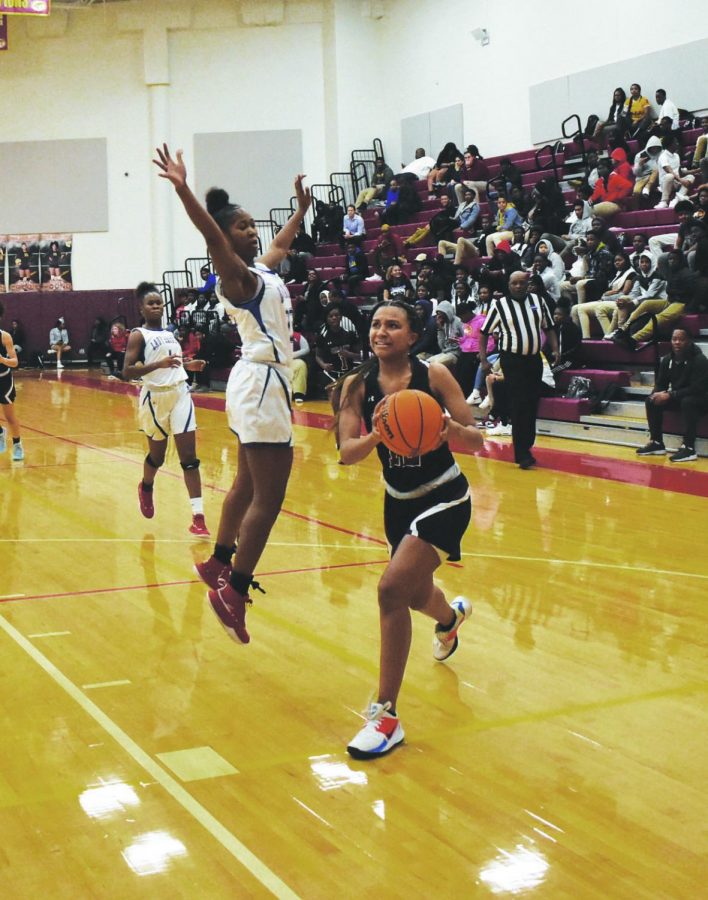 Sophomore Jade Lewis drives to the basket in the Region 6AAAAA semifinal game against Riverwood at Maynard Jackson on Feb. 6. The Knights lost 62-59. Lewis is the only member of the team to be named first team All-Region. Her sister, junior Trinity Lewis, was named second team All-Region and senior captains Jaliyah Lett and Kaitlin Palaian each received Honorable Mention.    