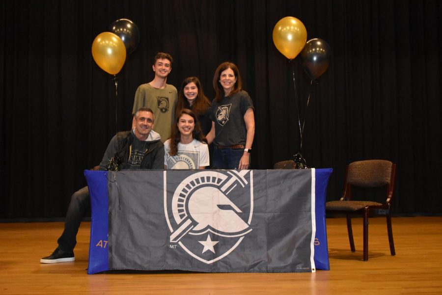 Soccer player Kaitlin Palaian sits with her family after signing with the U.S. Military Academy. She is the second Grady student to attend the school in West Point, NY since the class of 2018.