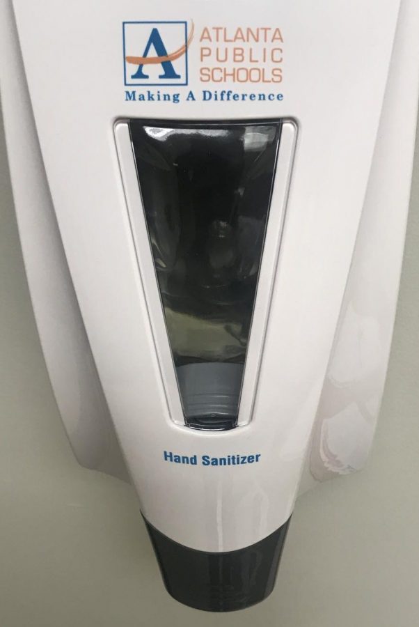 This hand sanitizer dispenser was recently placed next to the Kronos clock where teachers clock in for the day  in the Office of Student Affairs.