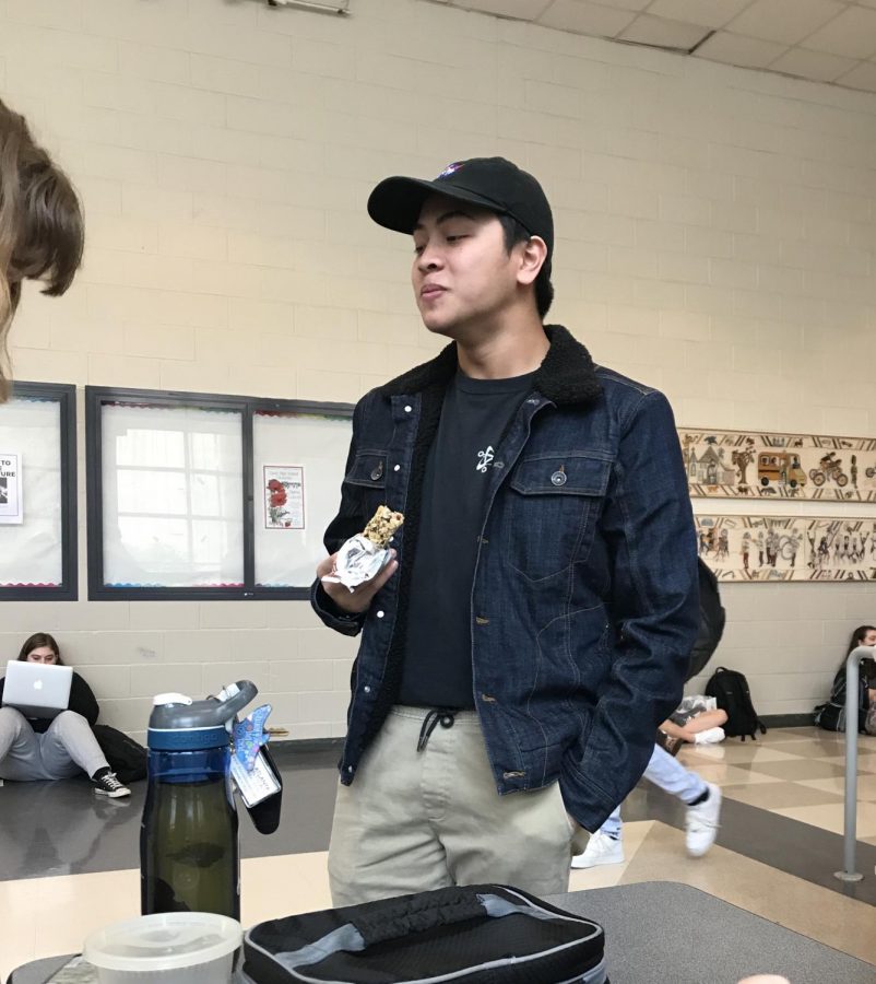 Senior Henry Nguyen is seen at lunch with his friends. Sophomore Kelly Tran is the only Vietnamese friend he has at Grady.