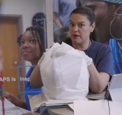 Atlanta Public Schools Superintendent Dr. Meria Carstarphen demonstrates the type of food assistance APS provides to needy families during a virtual town hall meeting on March 26.