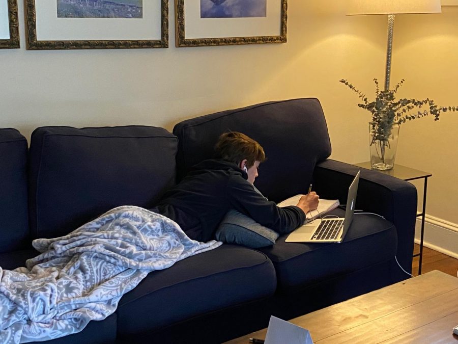 Junior Kevin Edwards participates in online classes during the school closure due to COVID-19 that is now scheduled to last until the end of the school year. 