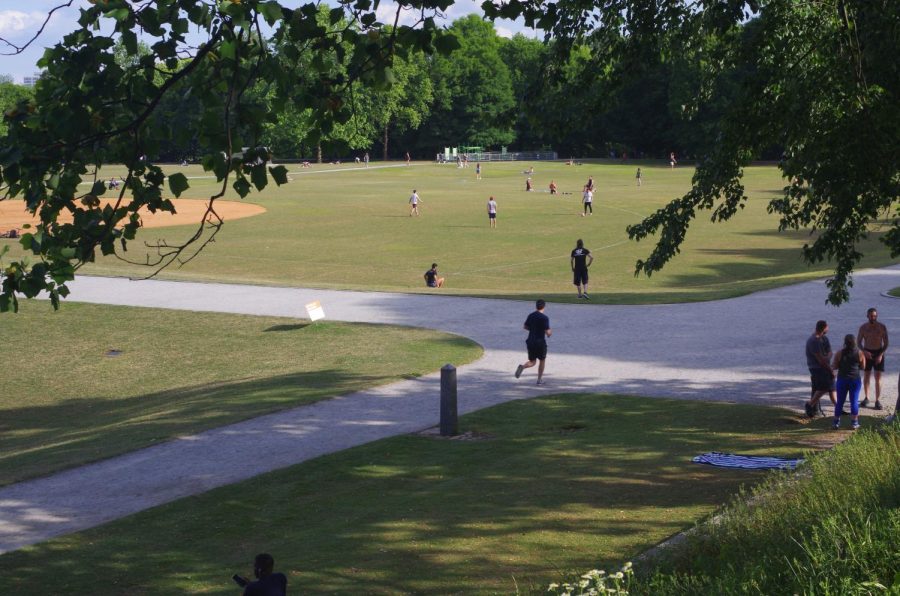 People take advantage of the warm weather and relatively uncongested Piedmont Park to spend time outside. The park has remained in frequent use by residents.