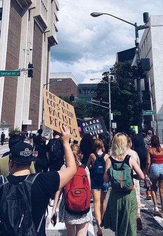 Participants in the Justice For Us protest march through the streets of Atlanta with signs demanding justice for victims of police brutality on May 29.