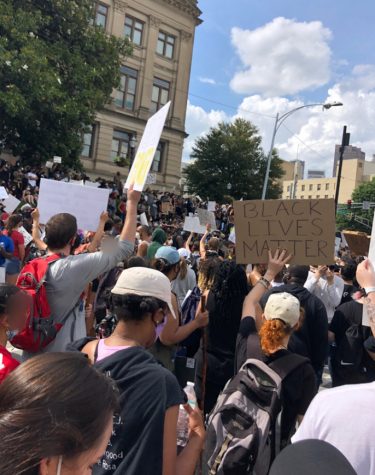 Nonviolent protesters marched to the Georgia State Capitol and gathered to protest police brutality on May 29, 2020 in downtown Atlanta. Some raise their fists as a symbol of solidarity.