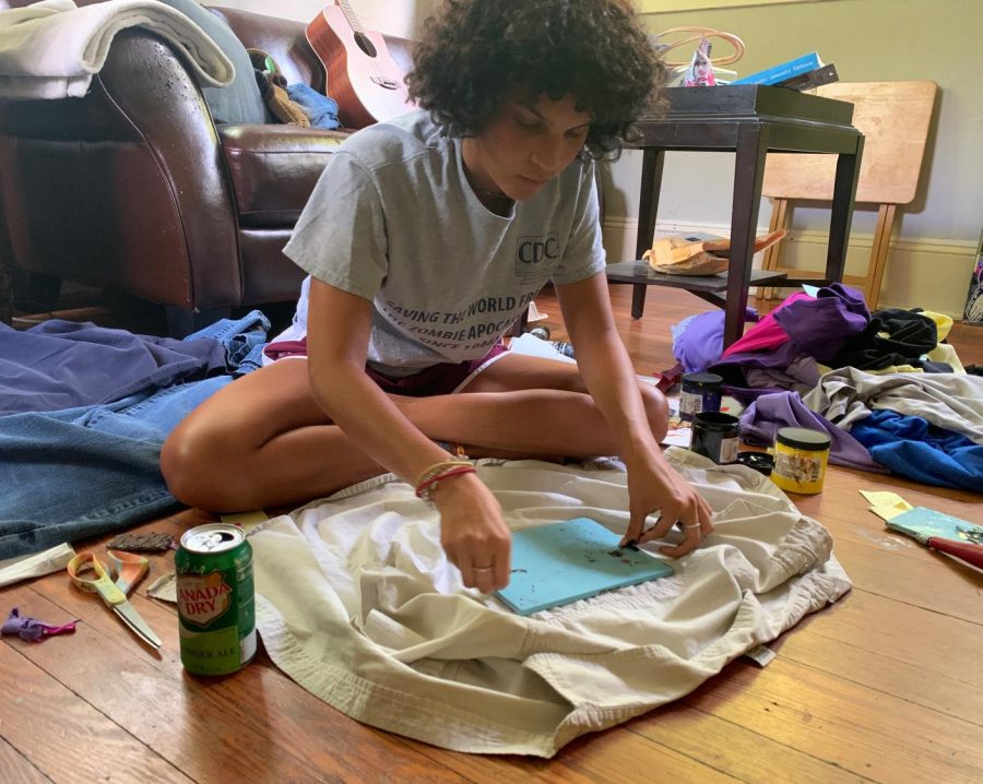 Senior Zola Sullivan embellishes a t-shirt with a hand-carved stamp. She will later list it on her Instagram account and will donate all of the proceeds to the Black Visions Collective and the Center for Black Equality. Sullivan has posted over 70 items for sale on her Instagram page @w4terforwings.