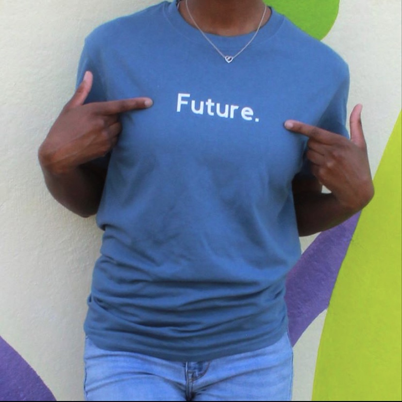 Swint shows off one of her recent designs. With the word Future, that stands for We are the future.