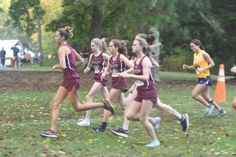 Five of Grady's top female runners spring to the front of the race in the regional meet, led by sophomore Jamie Marlowe.