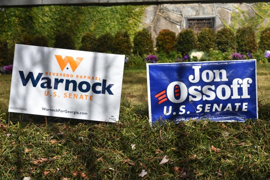Campaign signs supporting Senator-elect Raphael Warnock and Senate candidate Jon Ossoff dot the lawns of houses in the Grady community. 