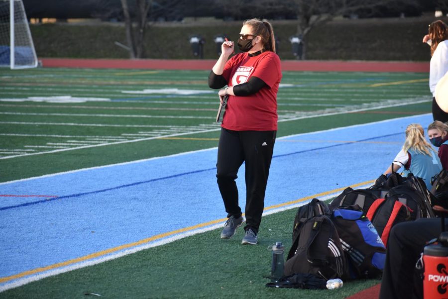 First-year head girls soccer coach Blair Barksdale examines the field during a scrimmage against Heritage on Jan. 29. The Knights lost 2-0.