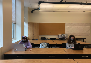 Students sit in the E200 Core Lab, where all the computers have been removed to allow for social distancing. 