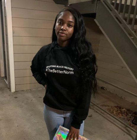 Senior ReOnna Vines wears a hoodie from her clothing brand Flier Attire. The hoodie showcases the #TheBetterNorm movement that springs from Vines poetry.