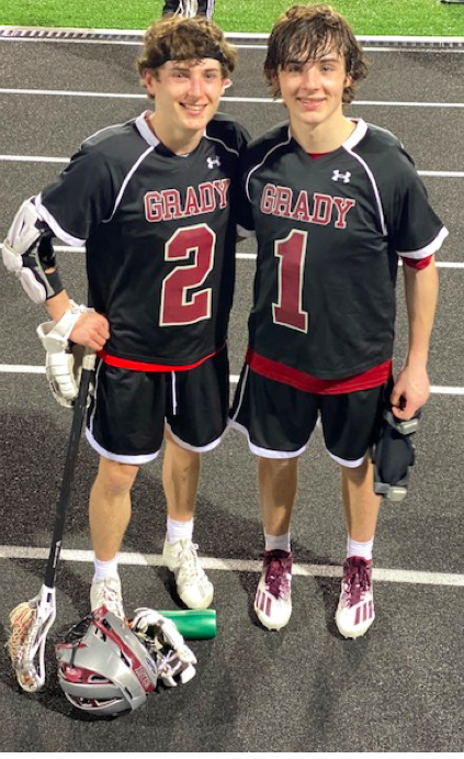 Kevin (left) and Brian (right) Edwards console each other after a match. The brothers have been playing lacrosse for most of their life. 