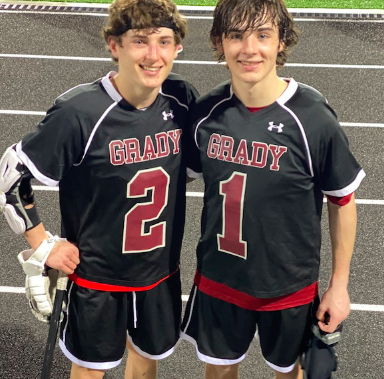 Kevin (left) and Brian (right) Edwards console each other after a match. The brothers have been playing lacrosse for most of their life. 