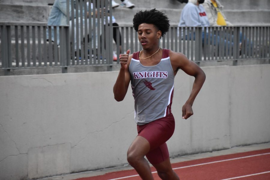 Senior+Fred+Hamilton+runs+the+200+meter+sprint+on+March+23th.+In+this+race%2C+Hamilton+achieved+his+PR.+Hamilton+has+also+found+success+in+both+the+300+and+400+meters+as+hes+ranked+highly+in+both.
