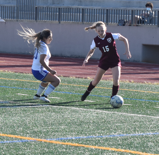 Senior girls soccer co-captain Elise Isakov dribbles past a defender during a first round playoff game against Cass on Wednesday, April 21. The Knights won 6-0.