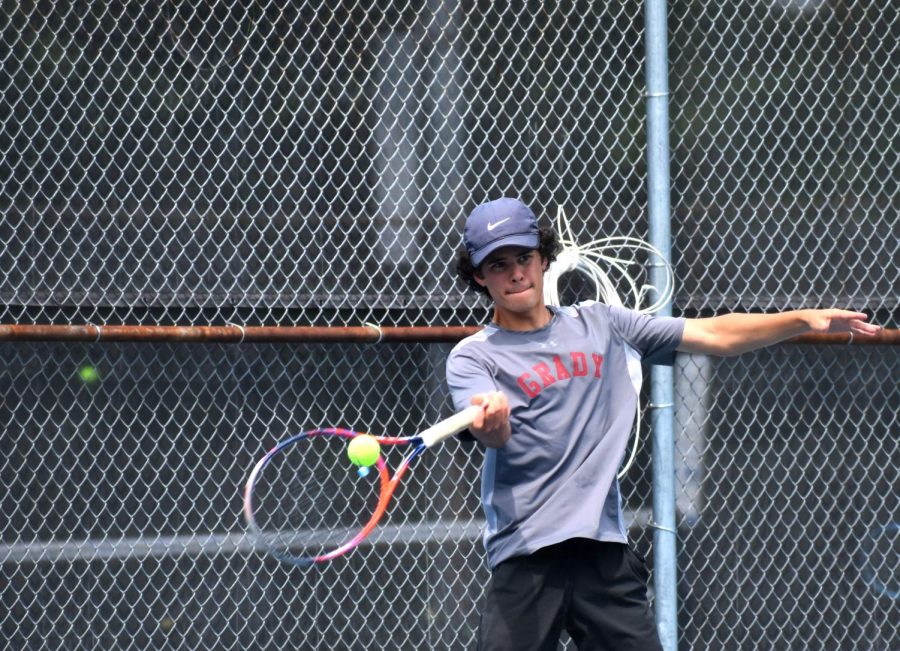 Senior co-captain Henry Edmeades returns a volley against Starrs Mill in the quarterfinals on Apr. 27. The Knights would go on to win the match 3-0 to advance to the semifinals against Coffee.