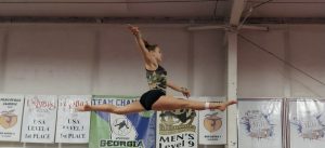 Sophomore gymnast Grace Tilley practices after school. Tilley said that the short length of leotards make her uncomfortable. 
