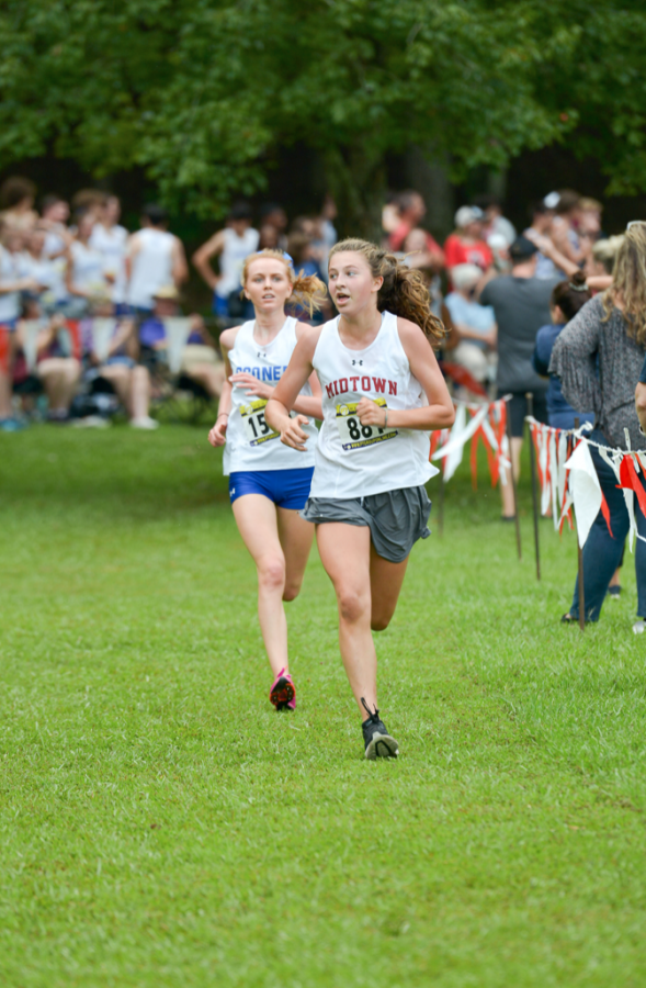 Freshman Cate Barton runs at Bob Blastow Early Bird Invitational Meet on Aug 28. She finished 9th with a time of 20:56.