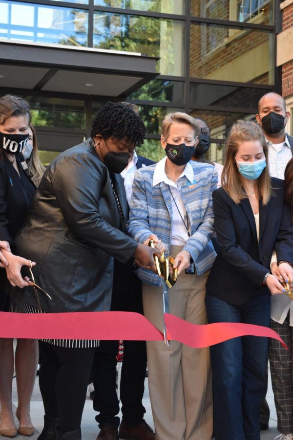 Atlanta Board of Education Member Leslie Grant (left), APS Superintendent Dr. Lisa Herring (middle left), Midtown Principal Dr. Betsy Bockman (middle right) and senior Ava Smith (left) cut a ribbon to celebrate the opening of the new building. 