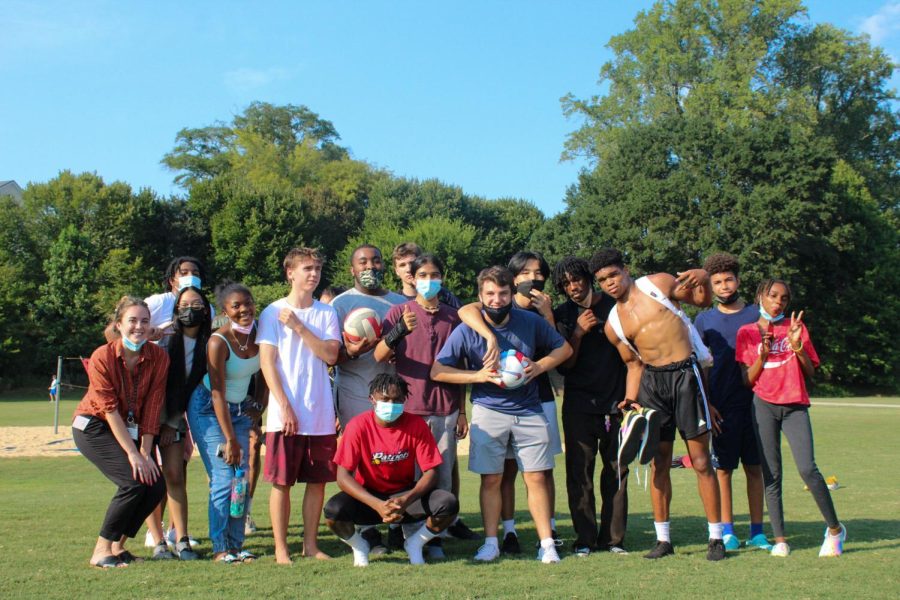 Members pose together for a club-member photo after a volleyball club meeting in Piedmont Park.