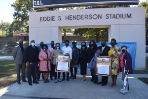 Family members and friends of Eddie S. Henderson are joined by APS administrators and board members at the stadium renaming ceremony.