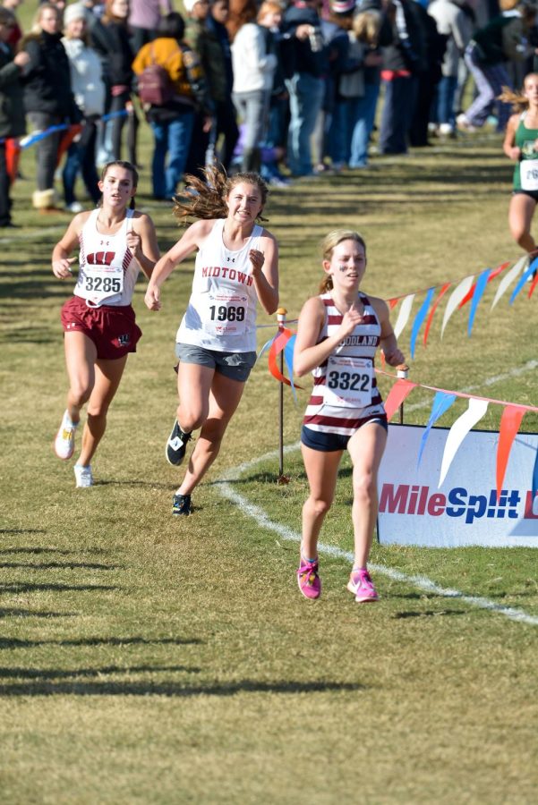 Freshman Cate Barton competes during the State 5A meet. Barton was the Knights number two finisher. I was just really excited to see how our team could do because this is what all the training has gone into,” Barton said.