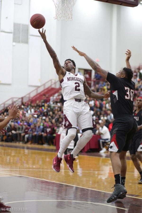 Tyrius Walker, a 2014 Grady alum, goes up for a layup while playing a game for Morehouse College. After graduating, Walker had a stint for the New York Knicks. 