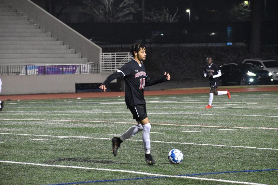 Senior Chase Palmer scans the field in the Knights scrimmage against Heritage on Friday, Jan. 21. The Knights won 5-0.