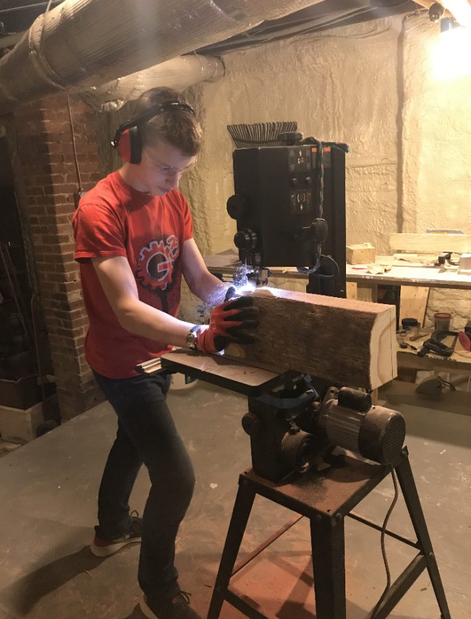 Junior Sam Prausnitz-Weinbaum works on a wood piece. He started during quarantine and has made a variety of things from wine holders to tables to cutting boards.