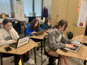 Staffers (left to right) Winnie Snyder, Emilia Weinrobe, Mia Pilot and Mia Garrett (front) work on meeting deadlines to produce the yearbook.
