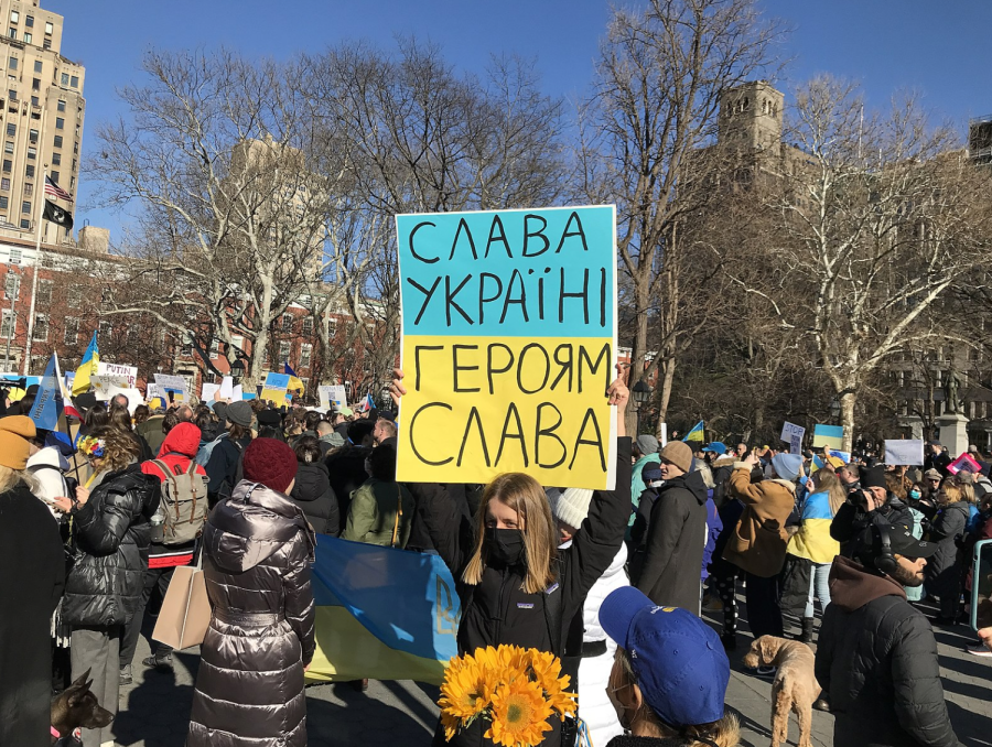Protestors gather in Washington Square Park in New York City to protest Russias invasion of Ukraine. The womans sign reads Glory to Ukraine. Glory to our heroes. 