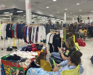 Customers shuffle through endless aisles of clothes in order to find the perfect piece to take home. Vendors curate their collections from local vintage stores in order to satisfy customers. 