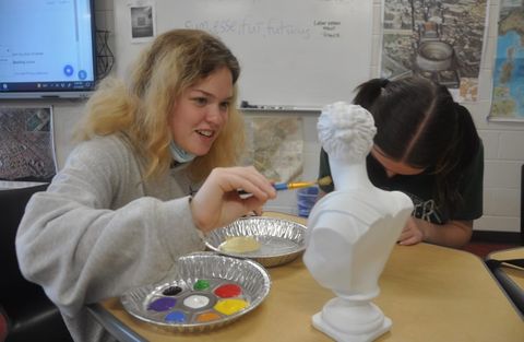 Junior Cat Sands paints a Roman bust during one of the monthly Latin Club meetings. Latin Club is one of the biggest clubs in the school with over 100 members. 