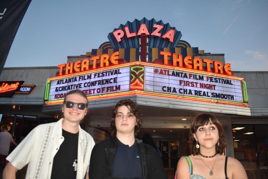 (Left to right) Alumni Zane McKinney and Spencer Cody and senior Malori Switzer stand proudly in front of the Plaza Theatre after their showing of their short film Kaleidoscope.