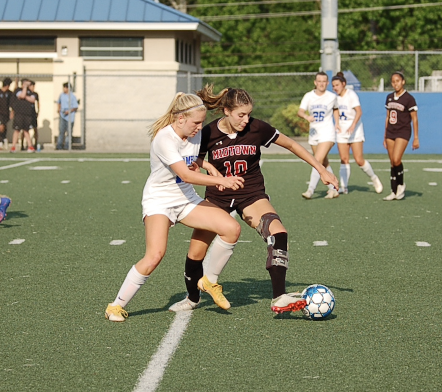 Junior Haley Chamberlain shields the ball from a defender in the state championship game against Chamblee. The Knights had a historic playoff run but fell short of the title with an 8-1 defeat. 
