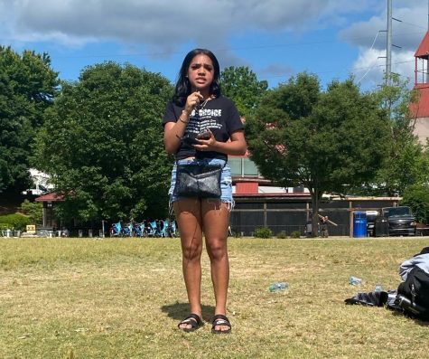 Senior Aaliyah Rapping gives a speech at Piedmont Park on Friday, May 13 about injustices women are facing with abortion and reproductive rights.