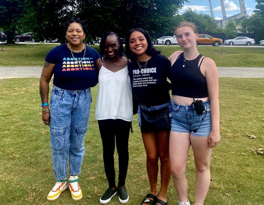 Freshman Anna Hutcherson (far right) and Senior Aaliyah Rapping (right) are joined by activists Kwajelyn Jackson (far left) and Agbo Ikor (left) at the Rally for Roe.