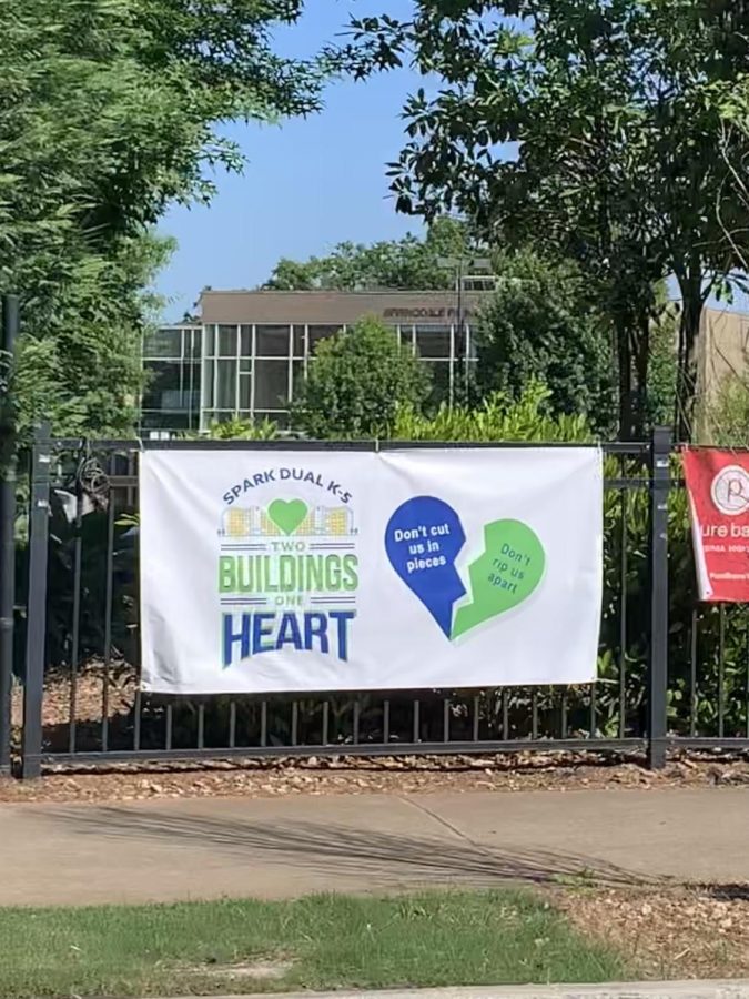 Signs showing favor for a SPARK dual campus are found posted outside Springdale Park Elementary. Many Springdale Park parents prefer the dual campus as opposed to a new K-5 elementary school in the cluster because it would rezone fewer students.