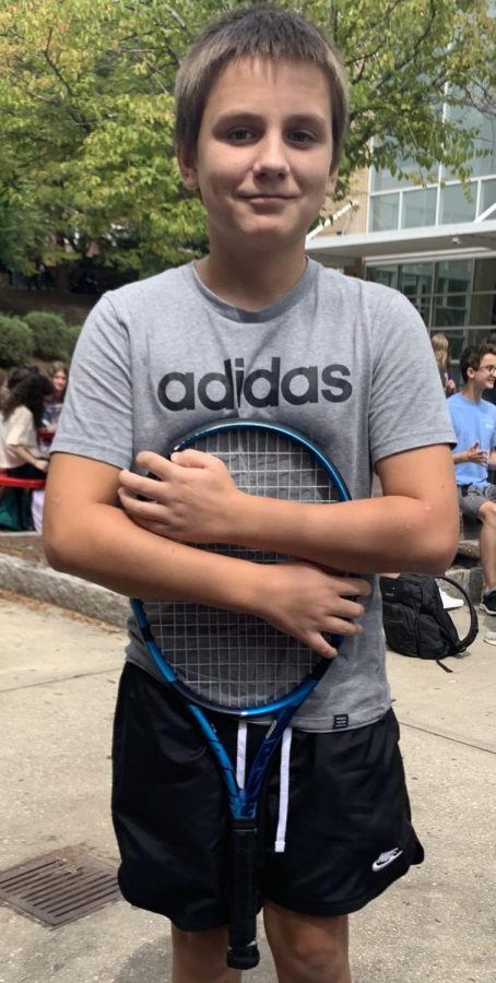 Fedorov holds his tennis racket during lunch.