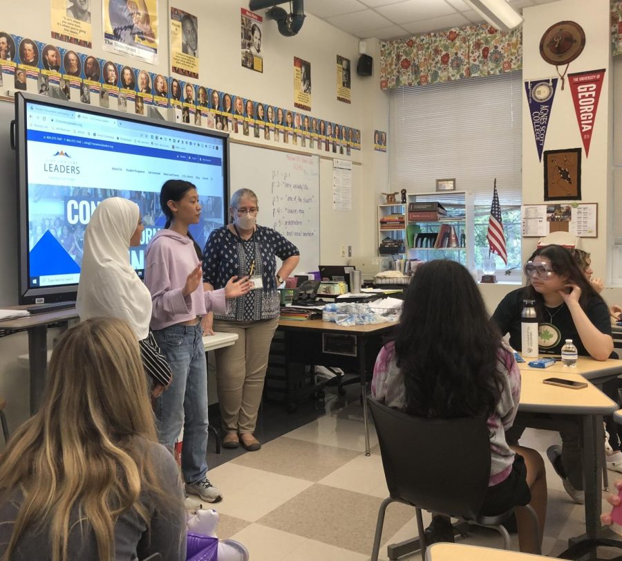Senior Sophia Wang (center), senior Salaam Awad (left), along with Mary Van Atta (right) lead the 21st Century Leaders club and discuss future plans and service opportunties.