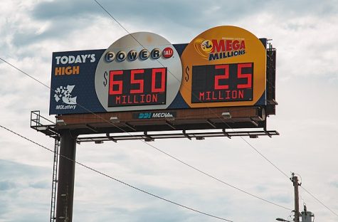 Participants of the lottery are able to view the possible winning numbers on the billboard for the Powerball and Mega Millions lottery game prizes. 